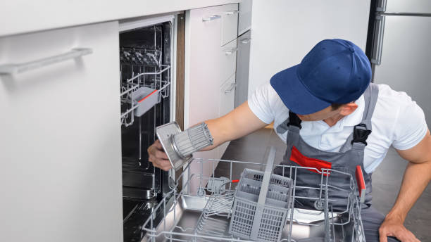 Technician repairing a dishwasher in Cape Town