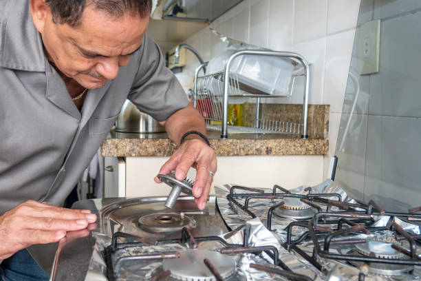 Technician repairing a dishwasher in Cape Town
